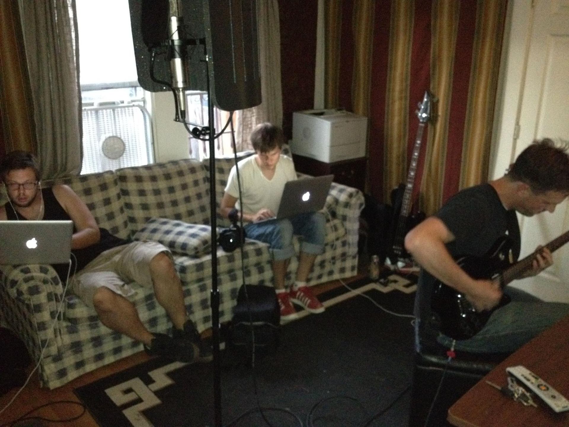Filmmakers editing on laptops